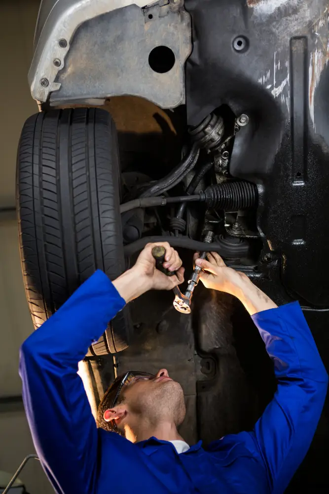 mechanic servicing car